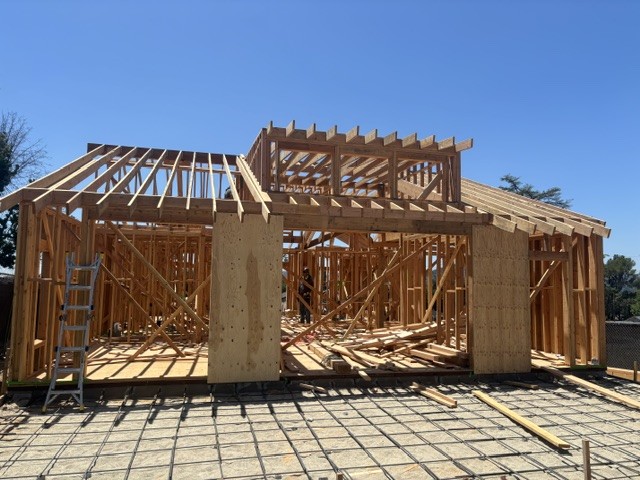 Residential home framing during new construction fire sprinkler rough-in
